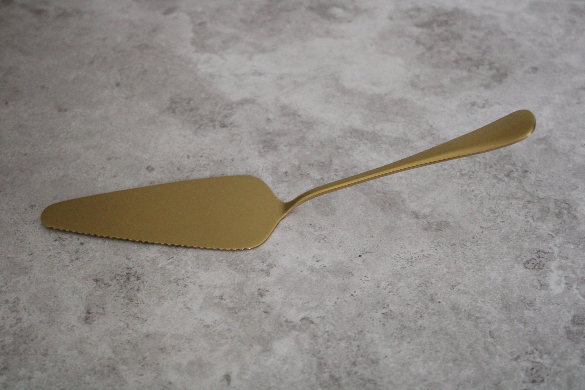 Gold Stainless Steel Cake Server with one serrated edge - 22cm